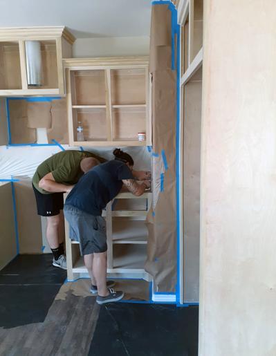 volunteers constructing a kitchen