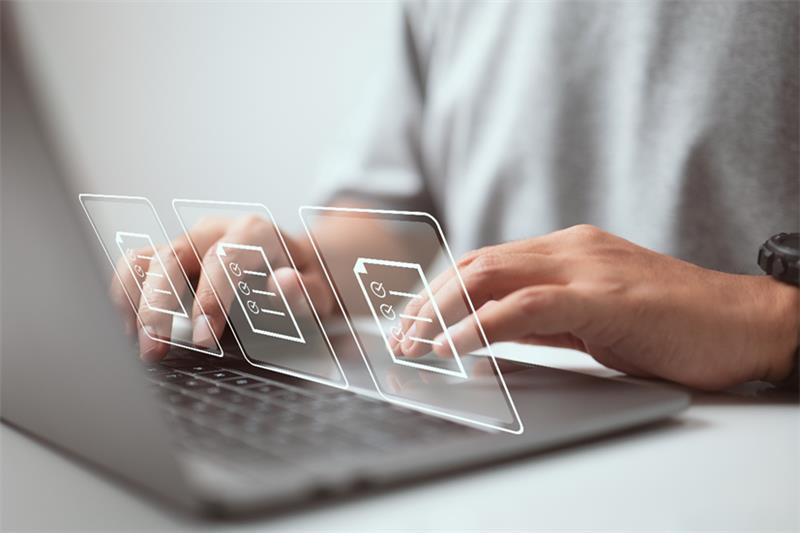 Typing on a laptop